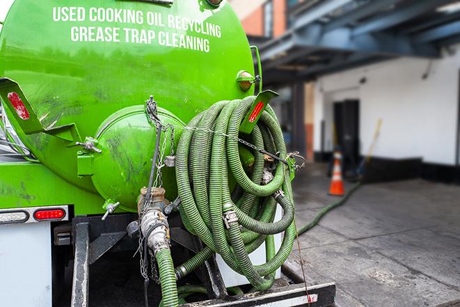 grease trap pumping truck servicing a restaurant in Encinitas